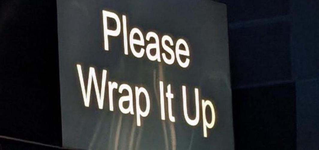 A picture of a screen at the 2023 game awards displaying the text please wrap it up
